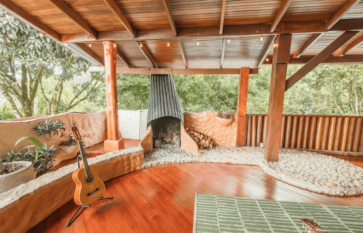Outdoor fireplace lounge with hardwood floors